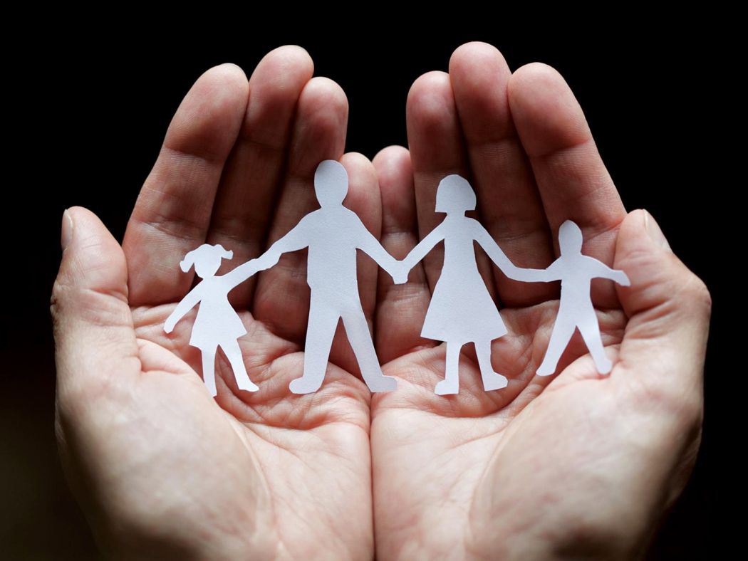 family_four_members_hands.jpg